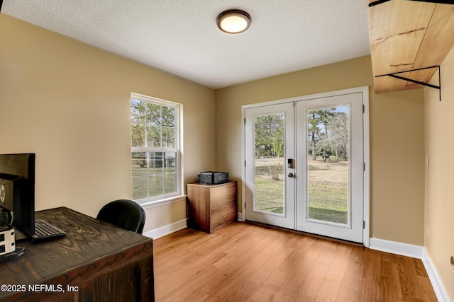 54110 Marlee Rd, Callahan, FL 32011 - office space with french doors, a textured ceiling, and light wood-type flooring