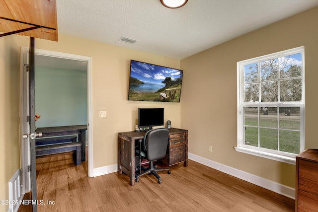 54110 Marlee Rd, Callahan, FL 32011 - office with light hardwood / wood-style floors and a textured ceiling