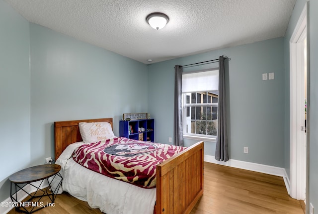 54110 Marlee Rd, Callahan, FL 32011 - bedroom featuring a textured ceiling and light wood-type flooring