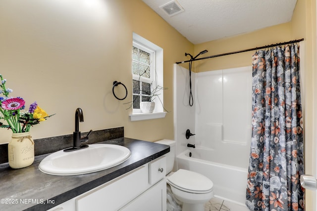 54110 Marlee Rd, Callahan, FL 32011 - full bathroom featuring vanity, shower / bath combo, a textured ceiling, and toilet