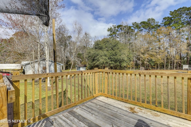 54110 Marlee Rd, Callahan, FL 32011 - wooden deck featuring an outbuilding and a yard