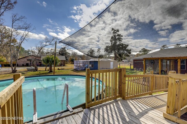 54110 Marlee Rd, Callahan, FL 32011 - view of pool featuring a storage shed, a yard, and a deck