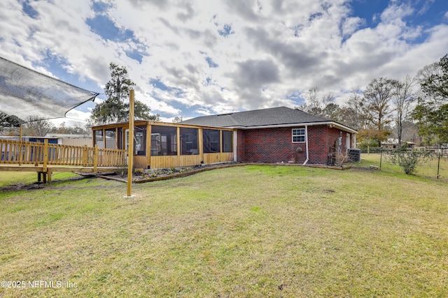54110 Marlee Rd, Callahan, FL 32011 - back of house with a sunroom and a lawn