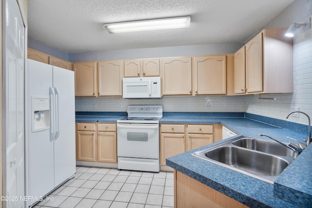 kitchen with tasteful backsplash, white appliances, light brown cabinetry, and sink