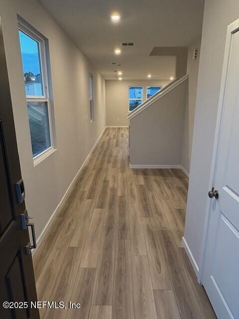 corridor featuring light hardwood / wood-style flooring