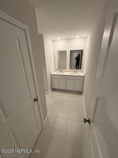 bathroom featuring tile patterned floors and vanity