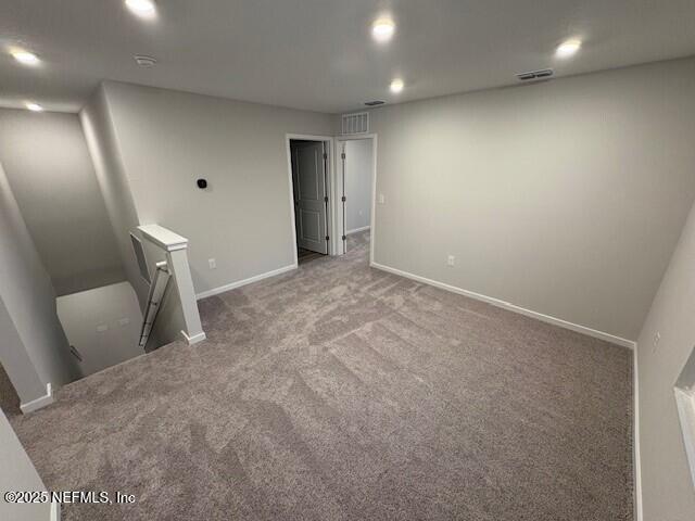 spare room with light colored carpet