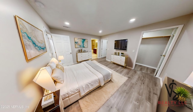 bedroom featuring light hardwood / wood-style floors