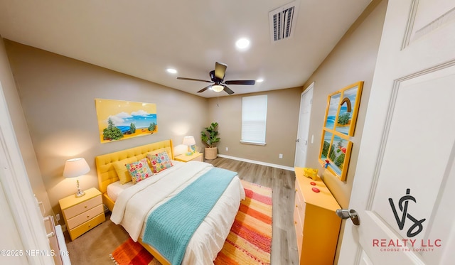 bedroom with wood-type flooring and ceiling fan