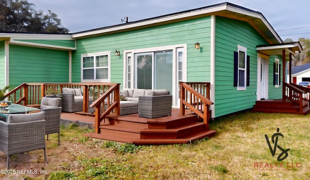 rear view of house featuring an outdoor living space