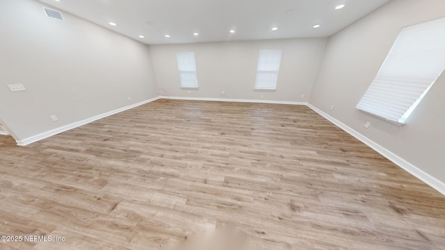 unfurnished room with light hardwood / wood-style floors