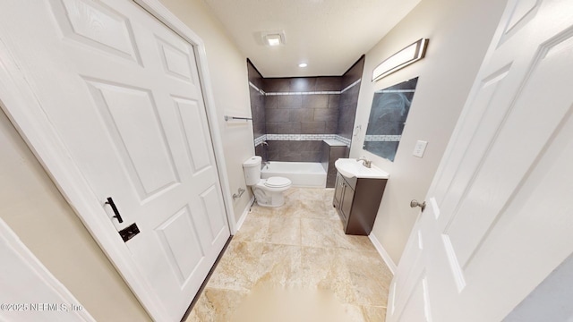 full bathroom featuring vanity, tiled shower / bath, and toilet