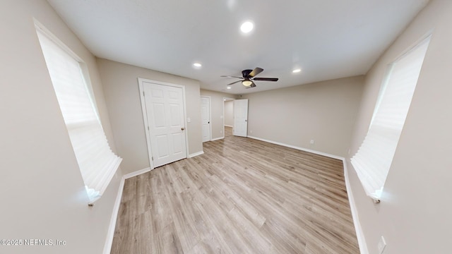 unfurnished bedroom featuring ceiling fan and light hardwood / wood-style flooring