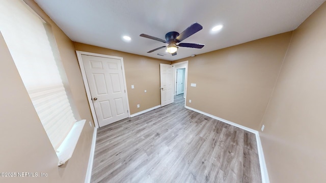 unfurnished bedroom featuring ceiling fan and light hardwood / wood-style floors