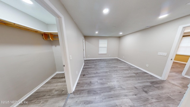 basement featuring light hardwood / wood-style floors