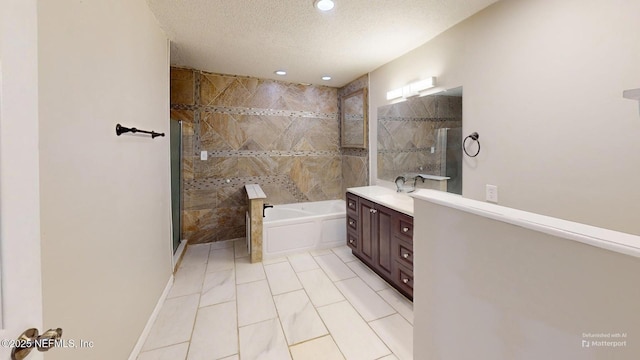 bathroom with tile patterned flooring, vanity, shower with separate bathtub, and a textured ceiling