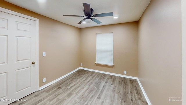 spare room with ceiling fan and light hardwood / wood-style floors