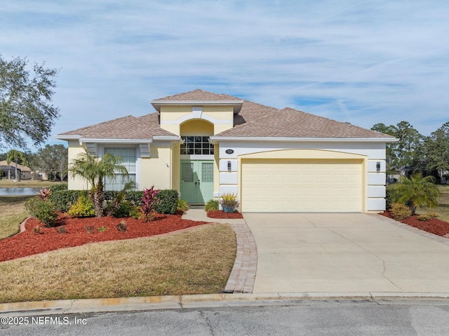 view of front of property featuring a garage