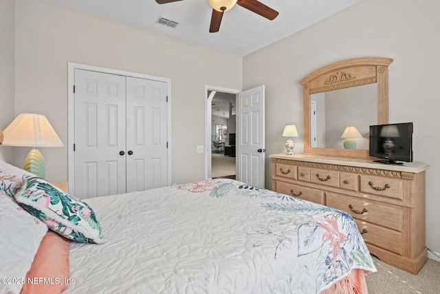 bedroom featuring carpet floors, a closet, and ceiling fan