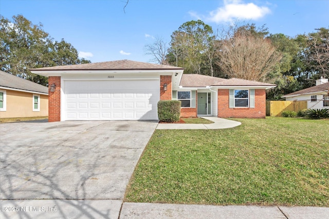 ranch-style home with a garage and a front yard