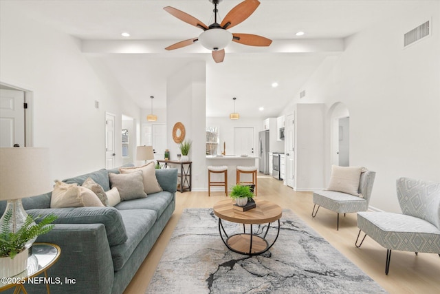 living room with ceiling fan, sink, high vaulted ceiling, and light hardwood / wood-style flooring