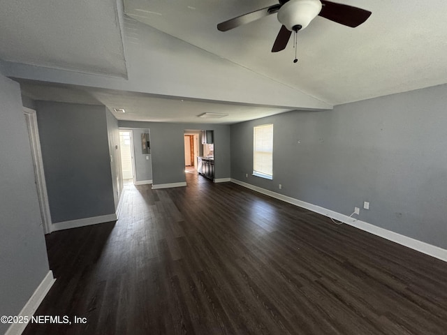 unfurnished living room featuring ceiling fan, lofted ceiling, and dark hardwood / wood-style flooring