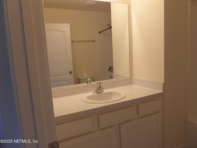 full bathroom with vanity, shower / washtub combination, and toilet