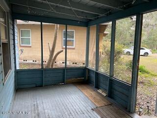 unfurnished sunroom with a wealth of natural light