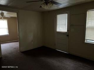 carpeted empty room with ceiling fan