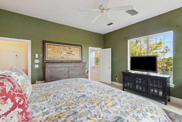 bedroom featuring light carpet and ceiling fan