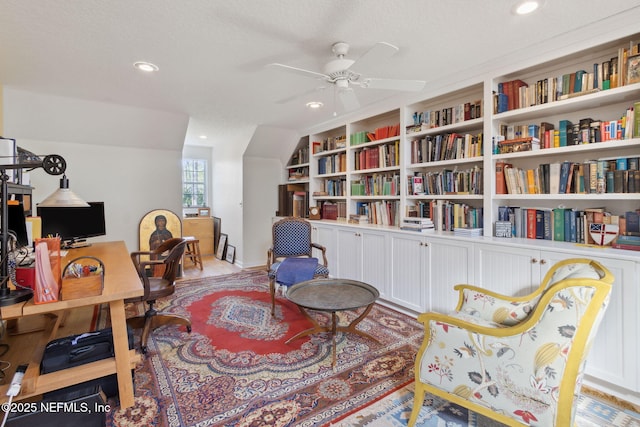 office space featuring a textured ceiling, built in features, and ceiling fan