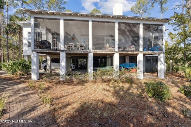 back of property featuring a sunroom