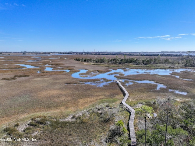 birds eye view of property featuring a water view and a rural view