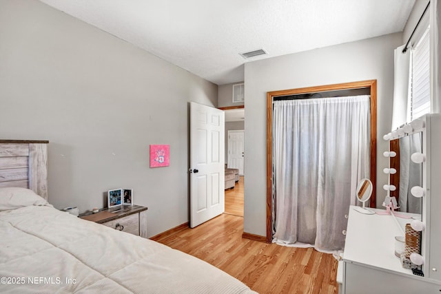 bedroom with light hardwood / wood-style flooring