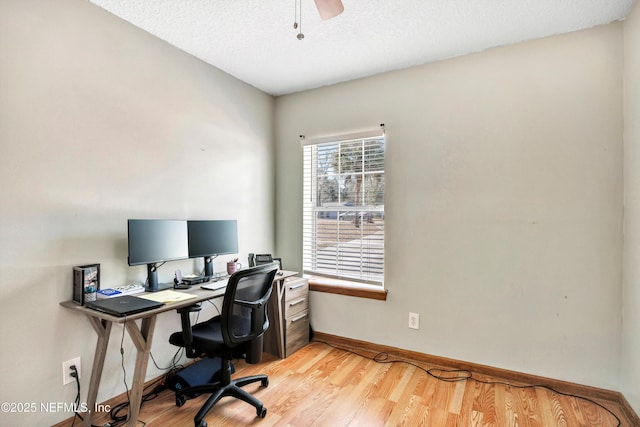 office with ceiling fan, a textured ceiling, and light hardwood / wood-style flooring