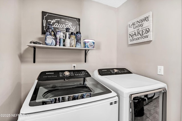 laundry room featuring washer and clothes dryer