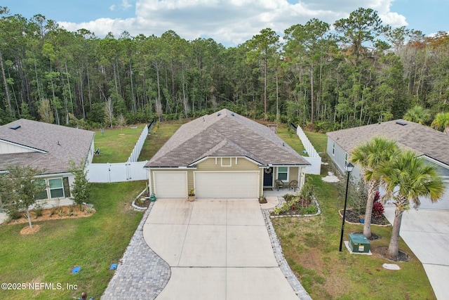 view of front facade with a garage and a front yard