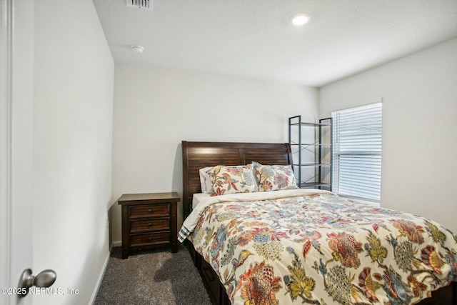 bedroom featuring dark colored carpet