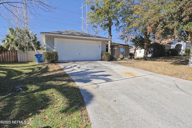 ranch-style home with a garage and a front yard