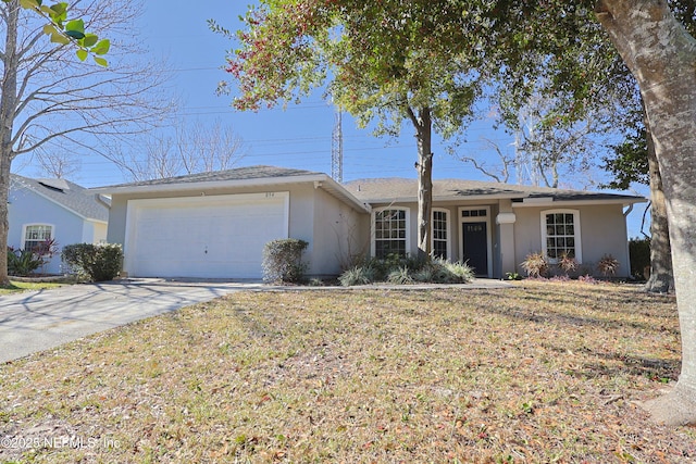 single story home featuring a garage and a front lawn