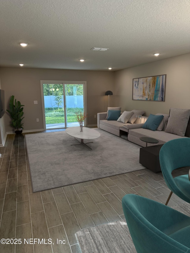 living room featuring a textured ceiling