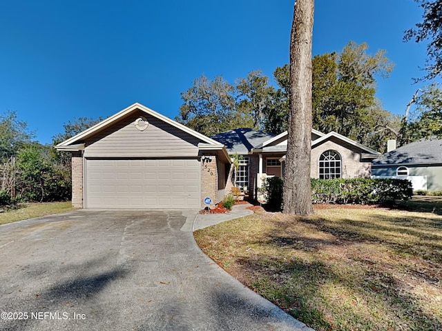 ranch-style home with a garage and a front yard