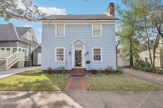 view of front of home with a front lawn