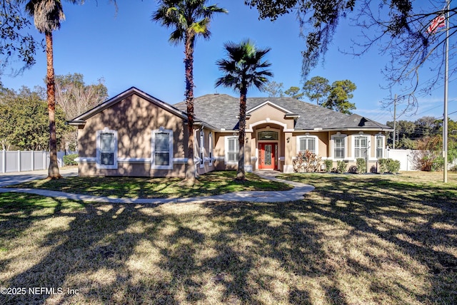 single story home featuring a front yard