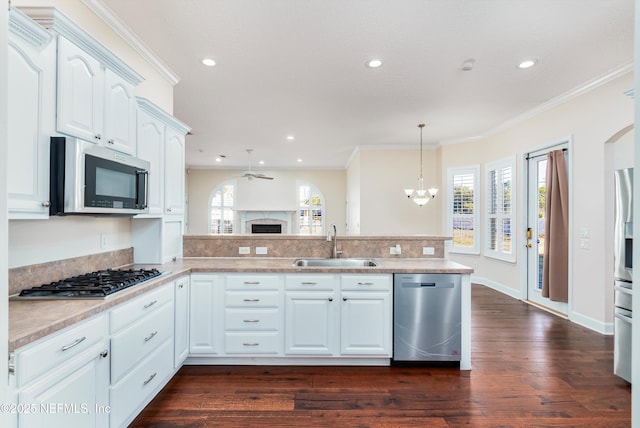 kitchen featuring white cabinetry, sink, plenty of natural light, and stainless steel appliances