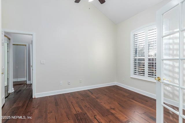 unfurnished room with lofted ceiling, dark wood-type flooring, ceiling fan, and french doors