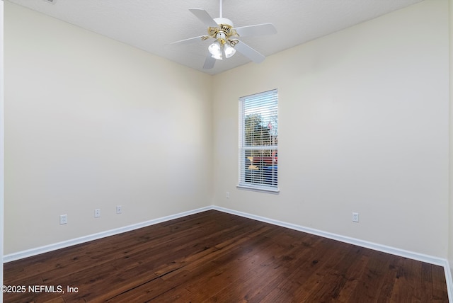 empty room with hardwood / wood-style flooring and ceiling fan