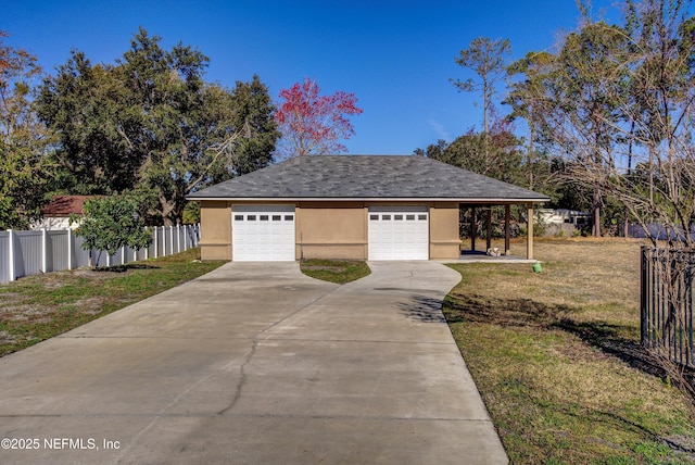 exterior space with an outbuilding, a carport, a garage, and a front lawn