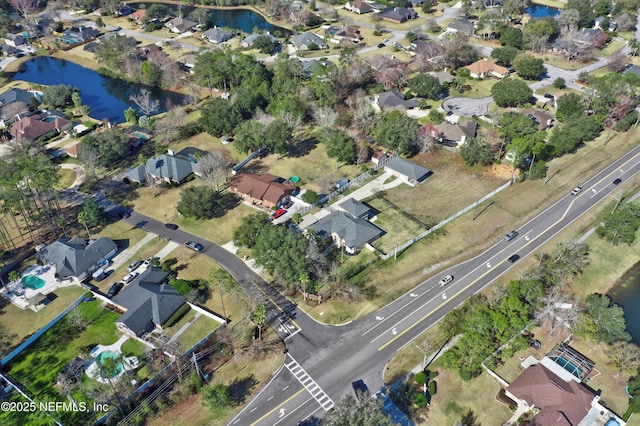 bird's eye view with a water view