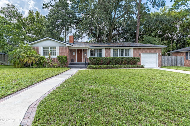 ranch-style home with a garage and a front yard